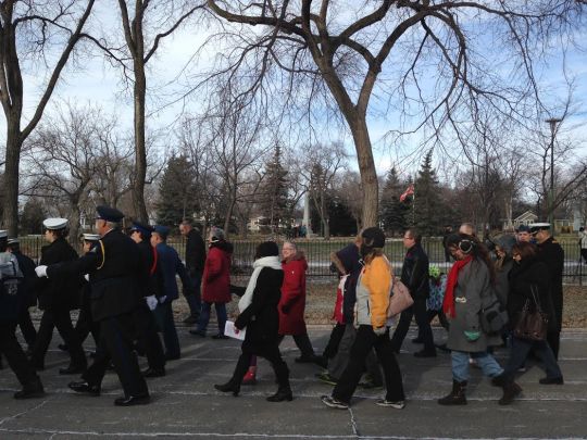 Those marching in the parade walk past the Memorial Park Circle on their way back to the Royal Canadian Legion.