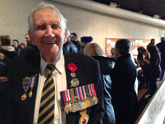 Second World War veteran Paul Martin, 93, shows off his badges at Transcona's Remembrance Day Service. 